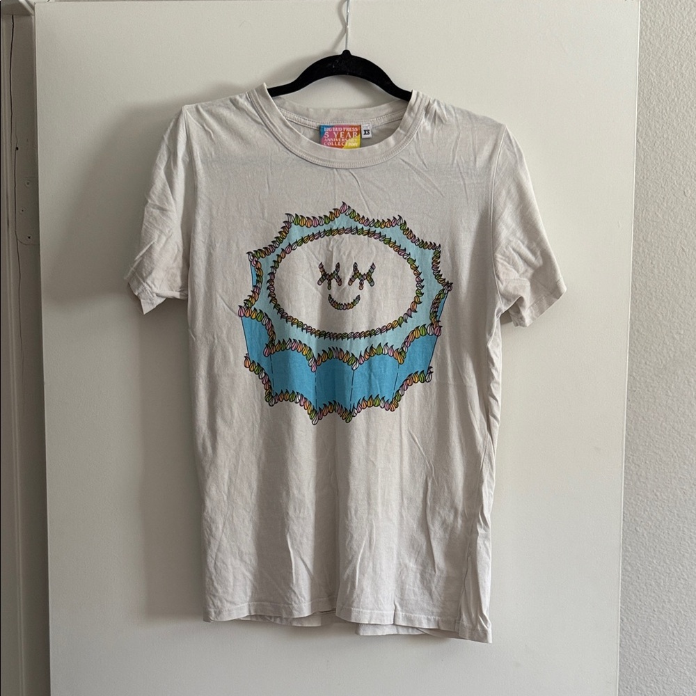Big Bud Press White Tee with Colorful Smiley Cake Design